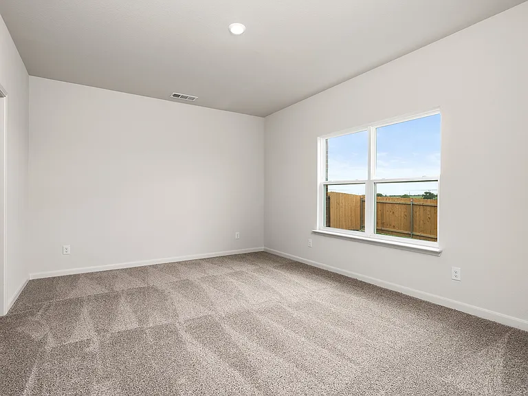The master suite has a large bedroom, ensuite bathroom and a walk-in closet.