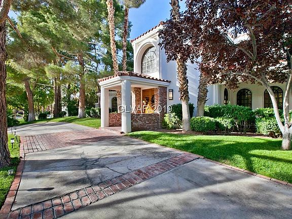 Lush green mature trees add privacy.  Prime interior lot location.