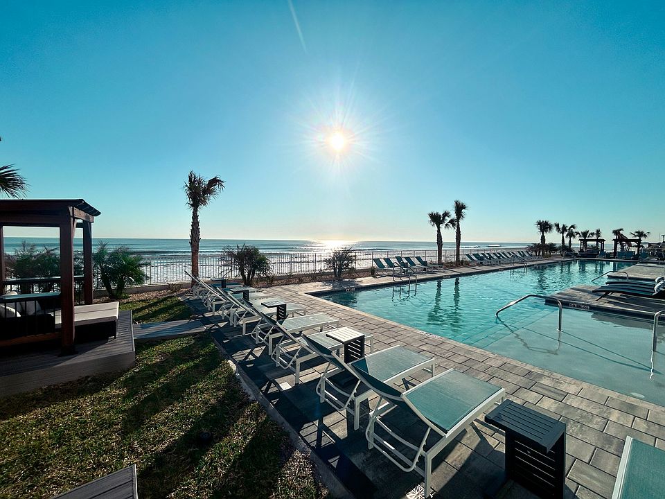 Bask in the sun by the poolside and soak up the perfect day of leisure.
