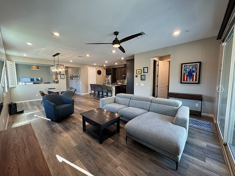 Another view from living room with dining room and kitchen in the background.