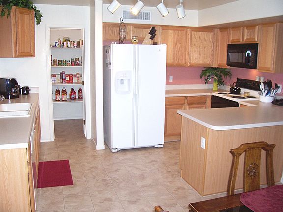 Clutter-free kitchen with lots of storage space, thanks to a huge pantry.