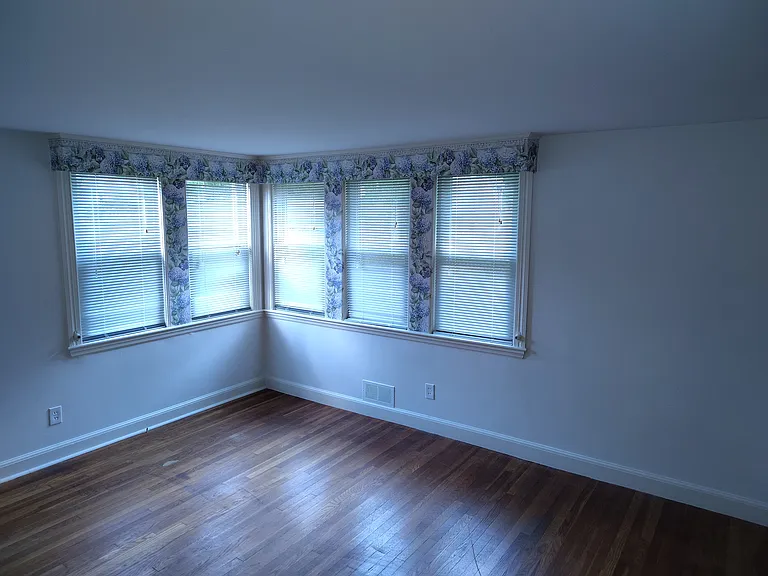 Master bedroom showing front and side windows.
