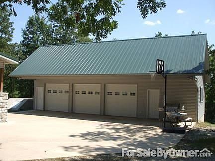 3 car garage with work room : Complete w/ automatic garage door openers, phone line, and wonderful w