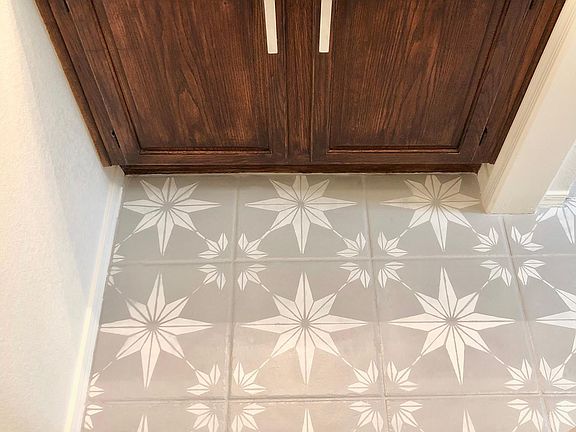 Close-up of bathroom floor and cabinets (located on the right side of the kitchen)