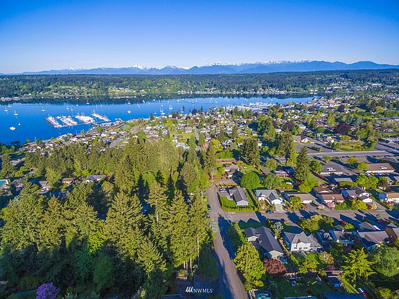 Western exposure with drone view of Liberty Bay and the Olympic Mountains!