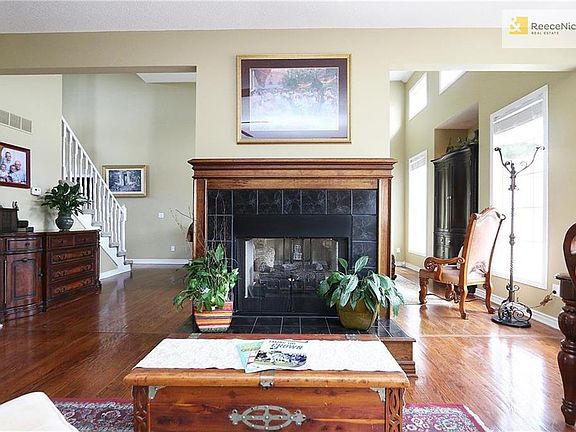 Look from hearth room into the front room. Kitchen is behind the photo and eat in part of the kitchen is to the right.