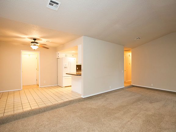 Recessed Family Room opens to Dining & Kitchen.