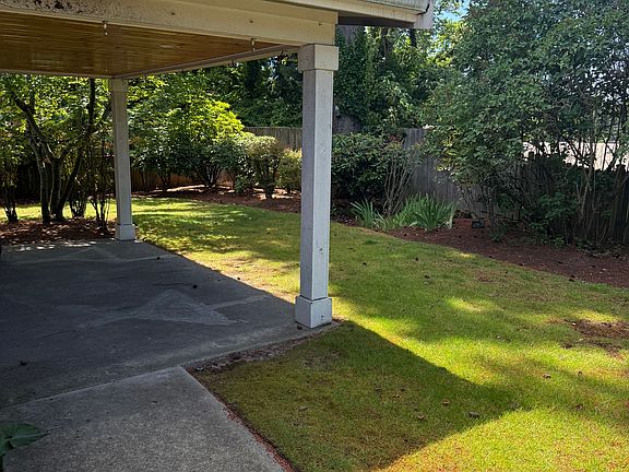 Rear covered patio off of Space 1