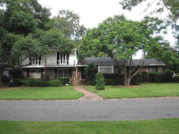 Front view showing balcony off of 2 of 3 upstairs bedrooms