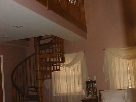 Spiral stairs to private loft in Master Bedroom
