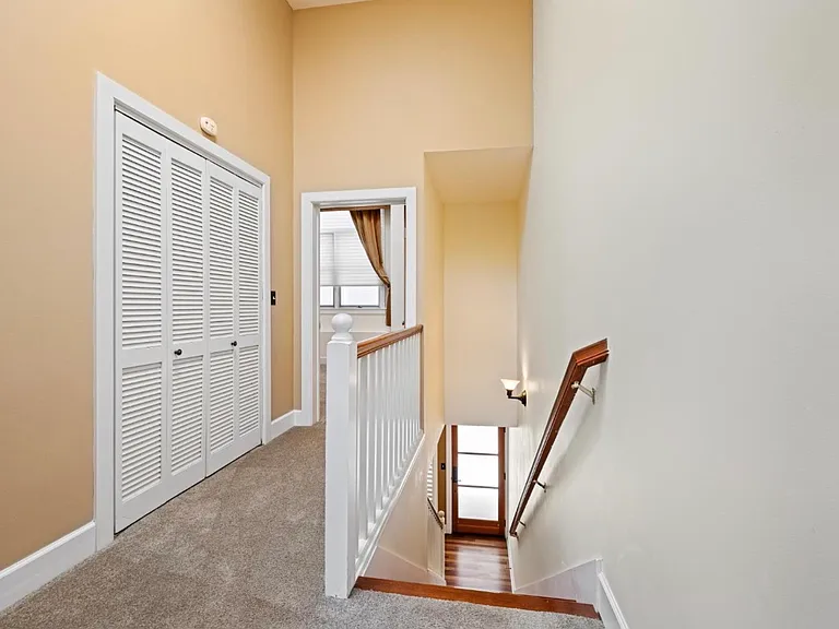 Upper level hallway to second bedroom and laundry