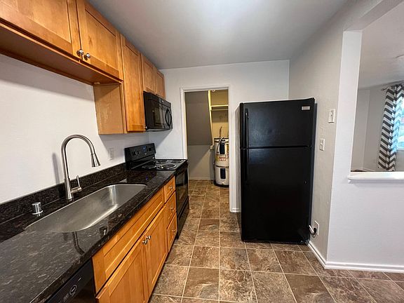 Kitchen & view of laundry/utility closet