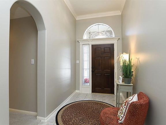 Entry with tile floors - hall to to the secondary bedrooms is shown on the left.