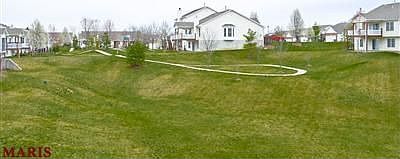 Overlooks common ground & walking trail