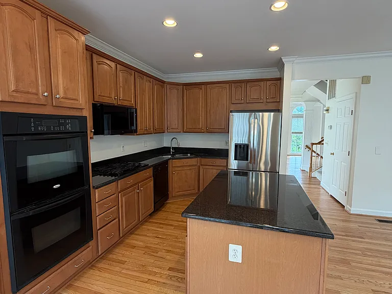 Kitchen with double oven to the left and a view towards the living room