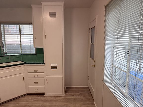 Back door provides convenient access to trash/recycling. Or open front and back and use screen doors to have cross-draft with safety!