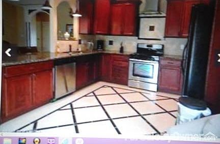 Gourmet Kitchen with breakfast nook : Spacious custom cabinets granite counters tile and marble floo