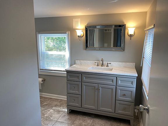 New full bathroom. Tile flooring, custom vanity.