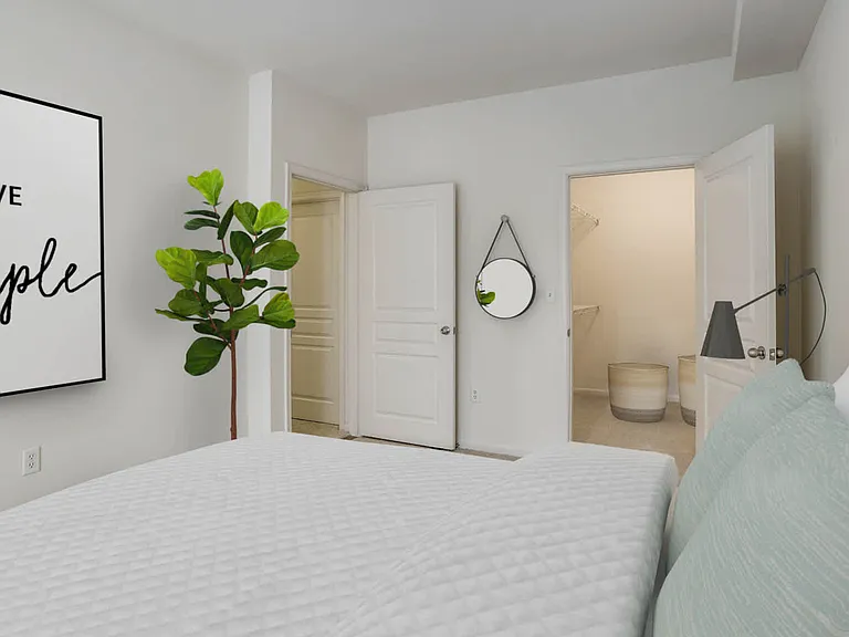 Carpeted Bedroom with Walk-In Closet
