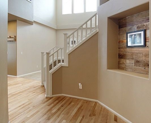 Another view of the entry, and the hall leading to the open kitchen and family room area.  Formal living room is straight ahead.  Lots of natural light.