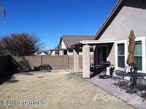 Covered patio with large rear yard
