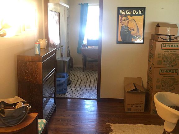 bedroom 1- wood floors plenty of natural light