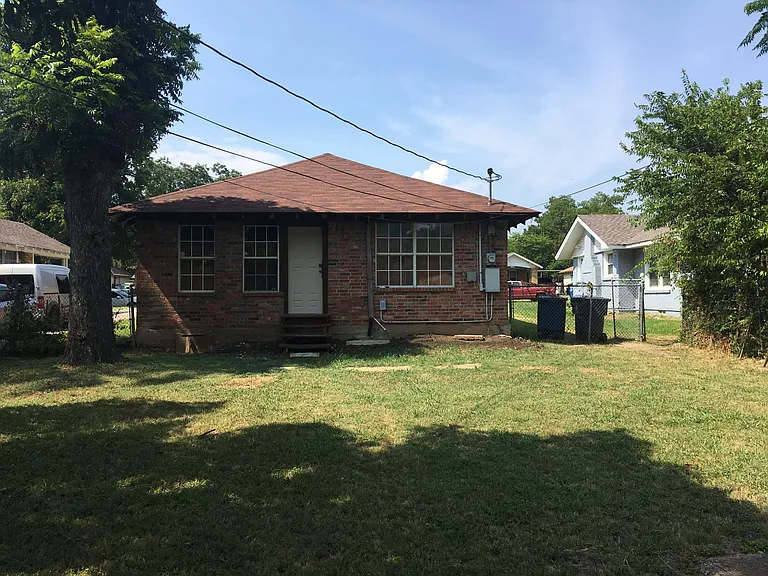 Back of home with big backyard which is fenced in also roof is about 3 years old.