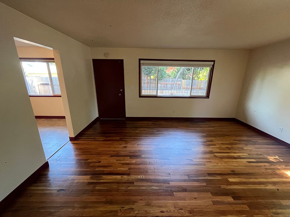Front door and living room with hardwood floors updated!