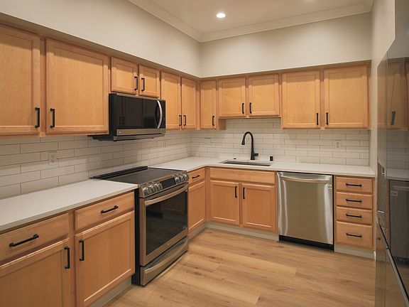 Large kitchen with updated appliances and quartz countertops