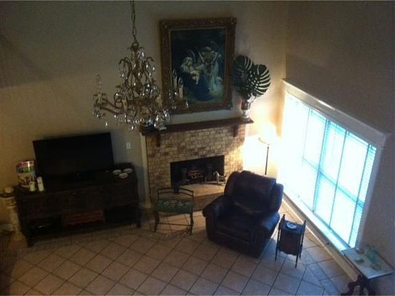 Living Room View from Upstairs, shows fireplace.