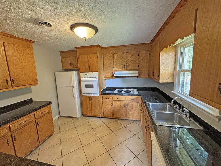 Great Kitchen, Granite Tile Countertops, Natural Light (Window looks into Back Yard)