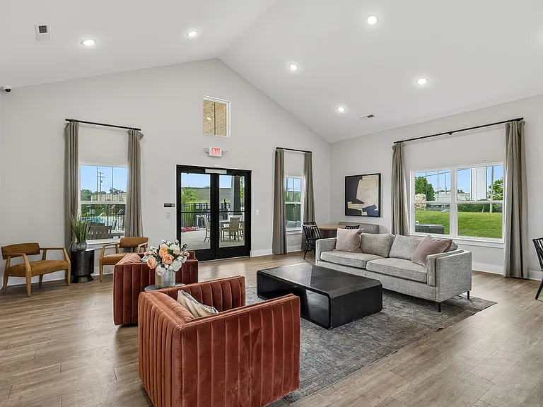 Comfortable resident clubhouse with indoor gathering space, perfect for working remotely, meeting neighbors, or relaxing.
