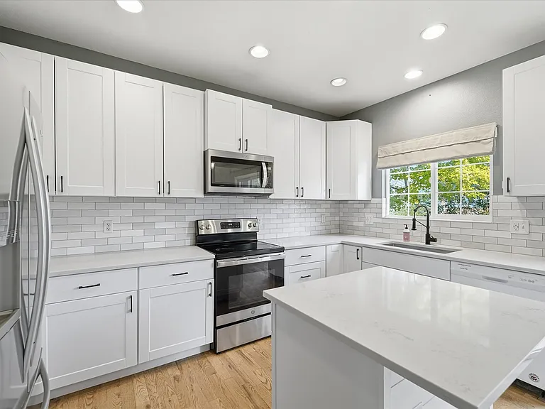 Plenty of prep and counter space. Kitchen overlooks backyard