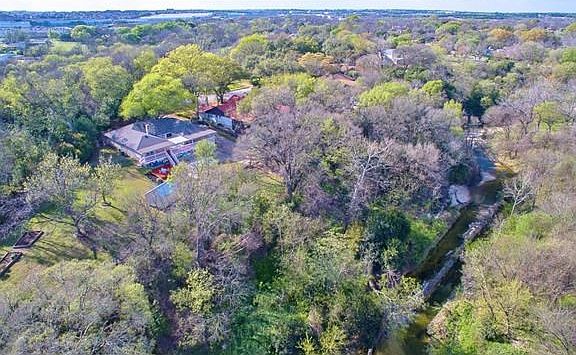 From this aerial photo you can see that 3640 Quiette Drive is situated on a large and private 1.04 acre lot.  On the left is the useable yard space with raised garden beds and on the right the property is bordered by Walnut Creek.