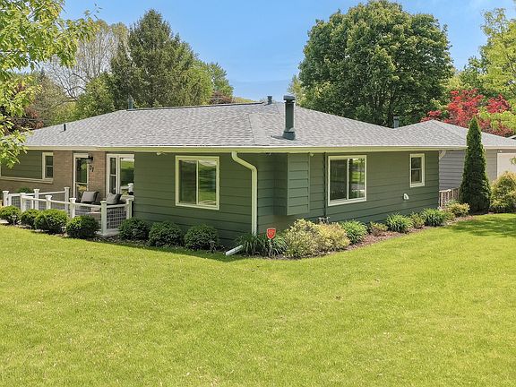 The home is located on a 3/4 acre corner lot with mature trees, well established perennial gardens, 