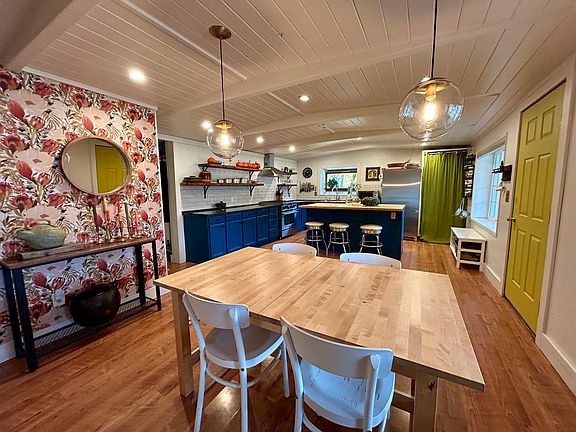 Looking through the dinning area to the kitchen. Table expands with a leaf to seat a larger group.
