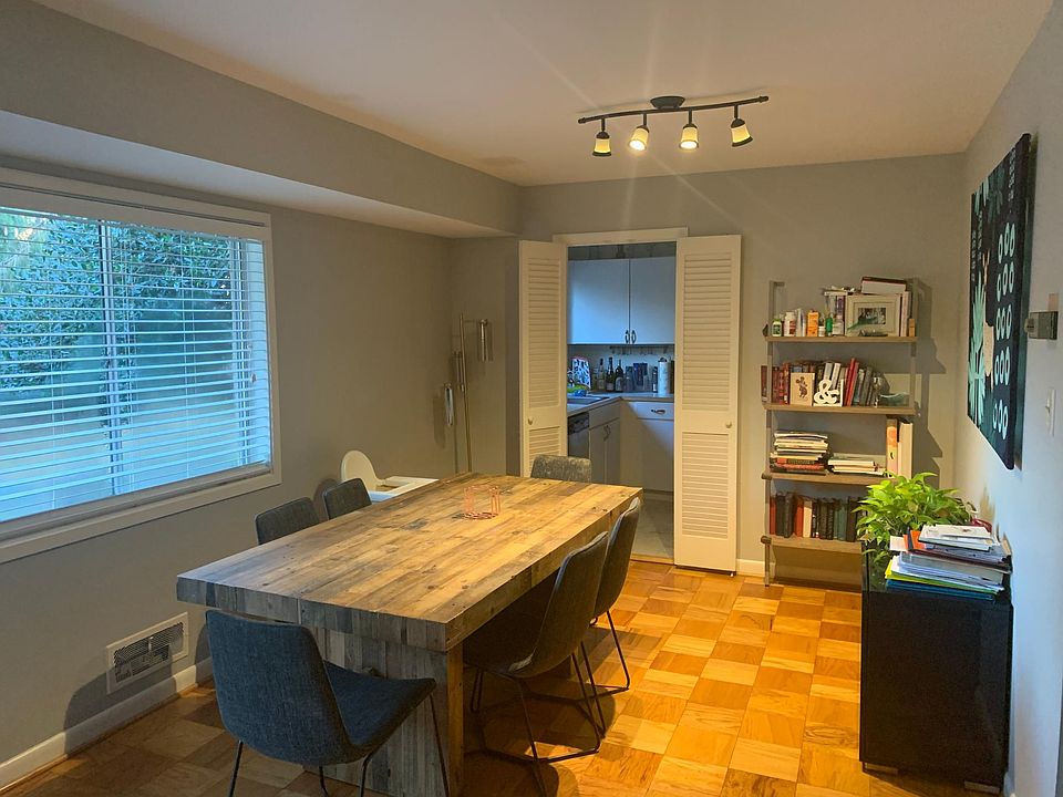 Spacious dining room overlooks tree-filled backyard