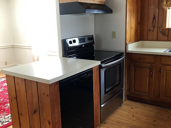 Kitchen with stainless steel stove and refrigerator. Includes a dishwasher.