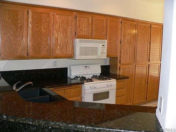 Walnut Laminate Wood Flooring in Living and Dining Area just ins