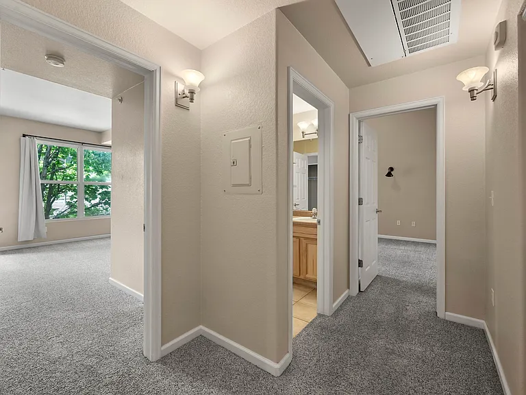 Hall layout: second bed, second bath, Primary bed, and laundry closet.