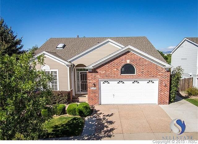 Sharp looking rancher with extended driveway parking pad