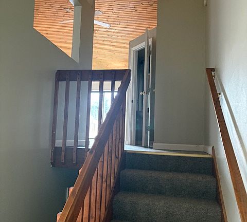 Landing after entering, this leads upstairs to Kitchen, dining room, half bath, living room, new sliding glass doors, and deck, patio, outdoor storage