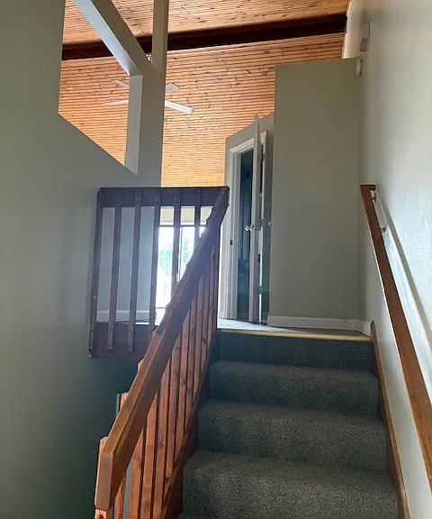 Landing after entering, this leads upstairs to Kitchen, dining room, half bath, living room, new sliding glass doors, and deck, patio, outdoor storage