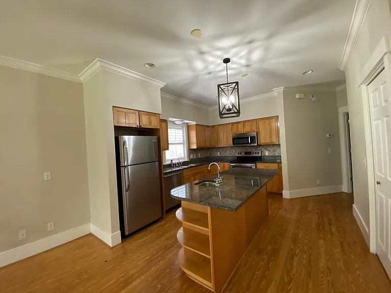 Kitchen. Entrance to Master bedroom is located on the ground floor to the right of the kitchen.