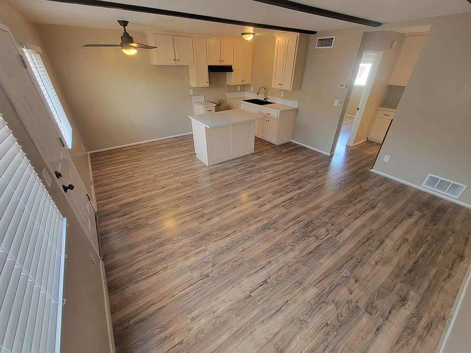 Kitchen has island and Quartz Countertops w/deep black quartz sink.
Note: Kitchen does not come equiped with appliances.