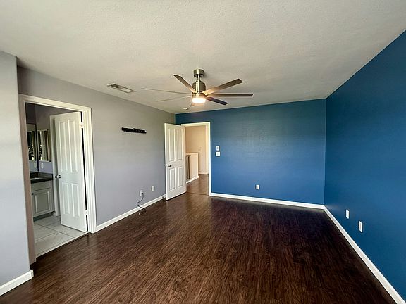 Primary Bedroom features ensuite bathroom and walk in closet