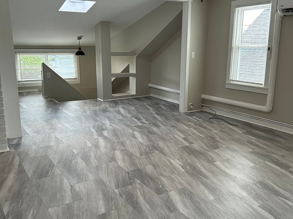Living room with new flooring, new mini-split air conditioning unit