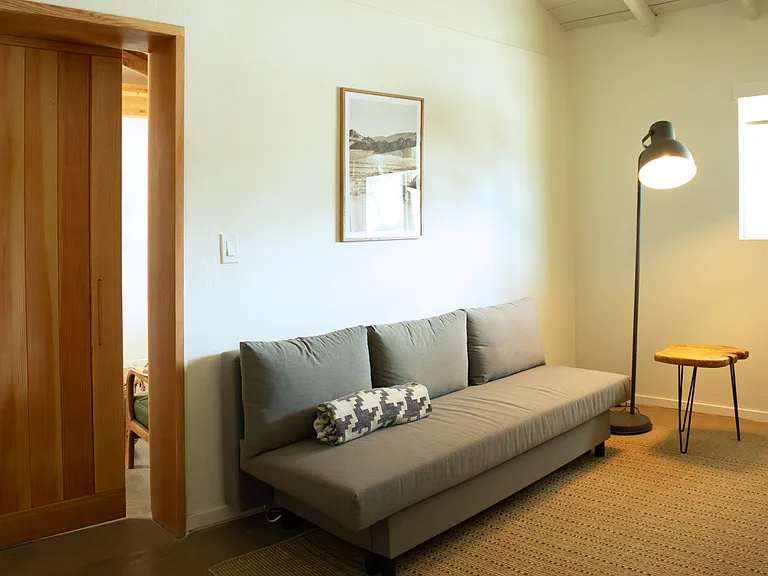 Office with sleeper sofa_ideal for workspace or additional sleeping.