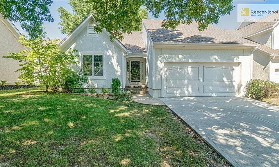 Free-standing patio home with newer driveway and roof.