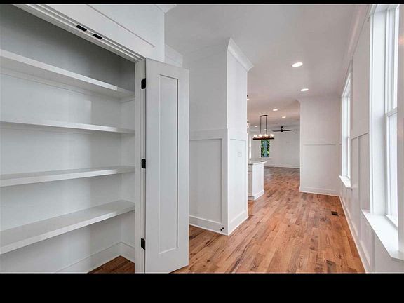 Hallway with great storage for all your kitchen needs.